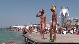 Busty blonde dances nude with two naked guys