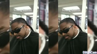 Rapper Young Gumbi getting his hair braided