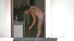 Brunette neighbor doing housework