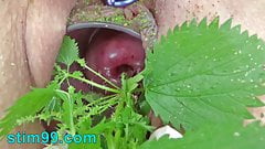 Extreme female inserting nettles into cervix and rod flowers