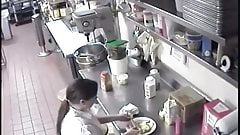 Preparing A Hot Dog For A Customer