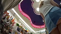 Upskirt blonde in mini jeans skirt – no panties ???