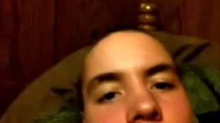 Young boy jerks off on bed