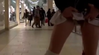 Girl walks around with a vibrator in pussy