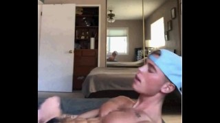ripped straight guy with baseball hat on pumps out a load
