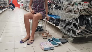 The lady in a hat without panties in the store Walmart