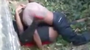 African guy fucking a girl outside with people watching