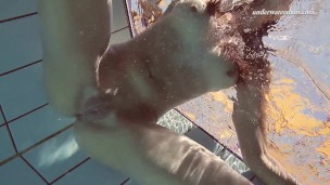 Swimming babe in the pool all alone