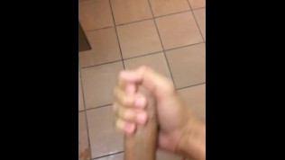 Black guy exhib at the urinals