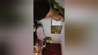 Cute young girl plays with butt plug in grocery store