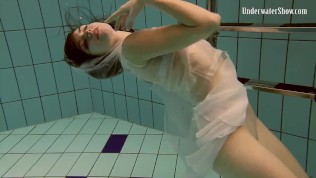 Shaved Andrejka with big tits in the pool