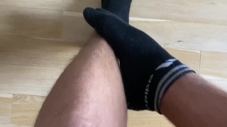 Boy feet in black socks