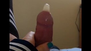 Cute crossdresser cums hands free, then again into the same condom