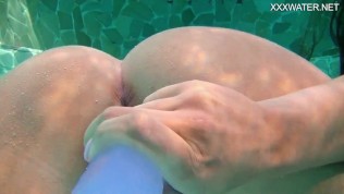 Hot euro teen Nora goes underwater in swimming pool to masturbate