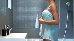 girl in a babydoll strips before shower