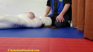 Girl is wrapped like a mummy for her own good