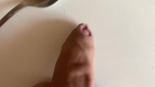 Spoon spanking his dick