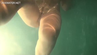Underwater babe Olga Kukuruzina swims strips and submerged underwater