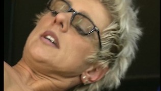 Shorthaired mature takes it in both holes